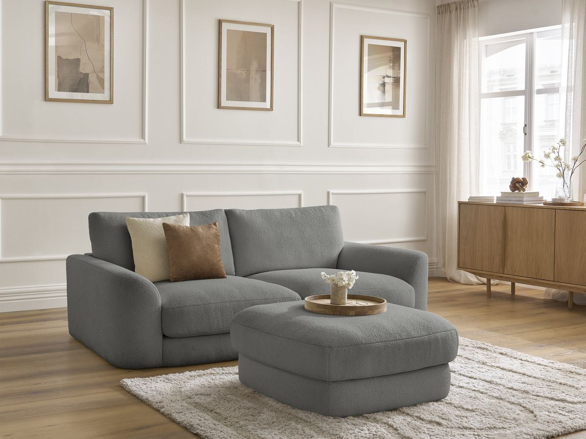 Sofa nierozkładana LEONORE tkanina bukla z pufą
